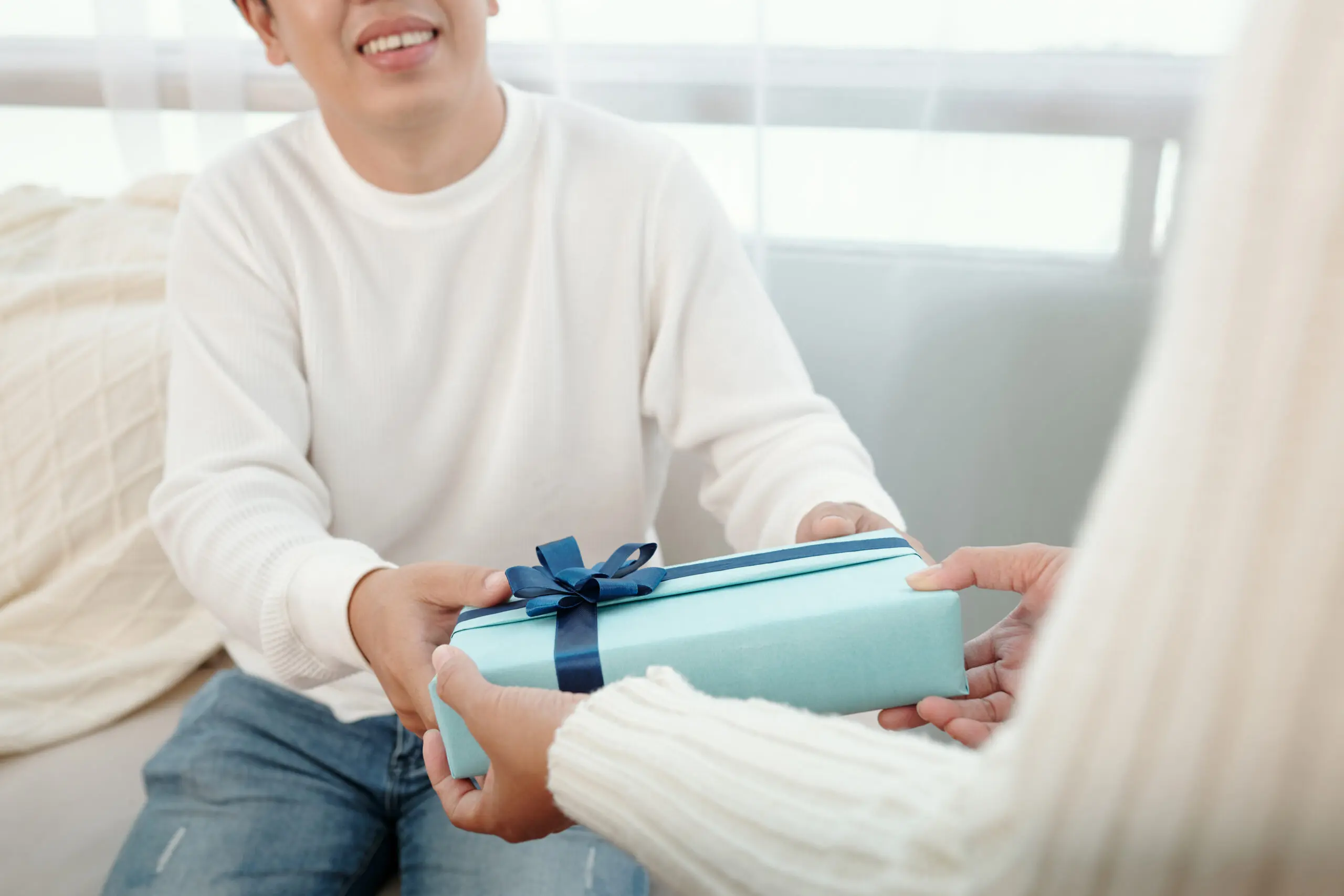 Man Accepting Present from Wife